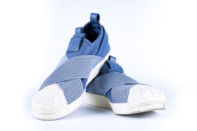 Close-up of shoes against white background