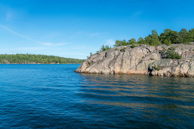 Scenic view of sea against blue sky