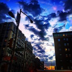 Low angle view of building against cloudy sky