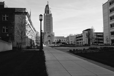 City street amidst buildings against sky