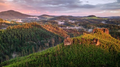 Scenic view of landscape and mountains during sunset