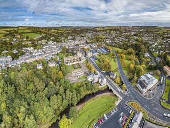 High angle view of street amidst trees in city