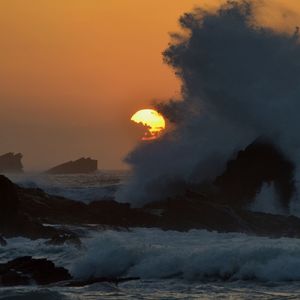 Scenic view of sea at sunset