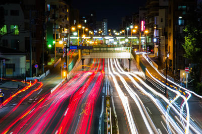 High angle view of light trails on road at night