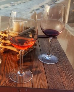 Close-up of wine glasses on table