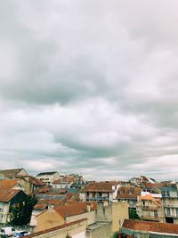 High angle view of townscape against cloudy sky