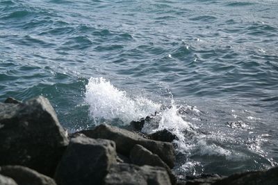 Waves splashing on rocks