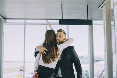 Young couple standing at home