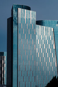 Low angle view of modern building against clear sky