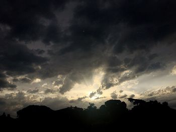 Scenic view of mountains against cloudy sky