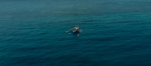 High angle view of man surfing in sea