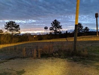 Scenic view of field against sky during sunset