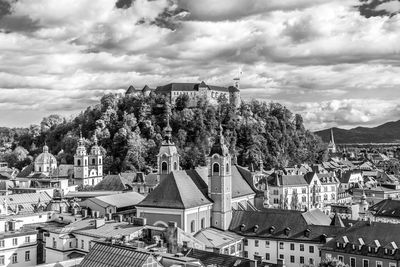 Buildings in town against sky