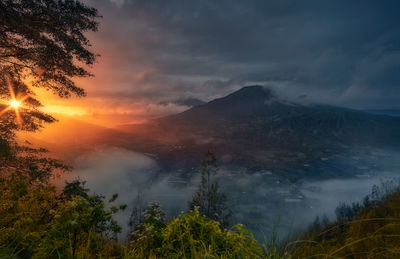 Scenic view of landscape against sky during sunset