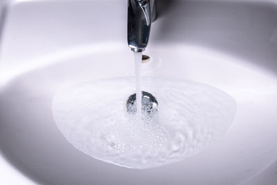 High angle view of water falling from faucet