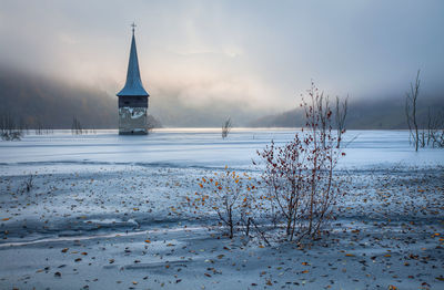 Scenic view of frozen lake against sky