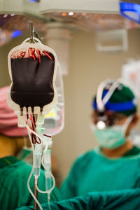 Midsection of woman wearing mask