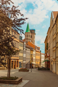 Buildings in city against sky