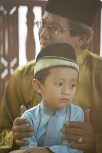 Close-up of boy with grandfather