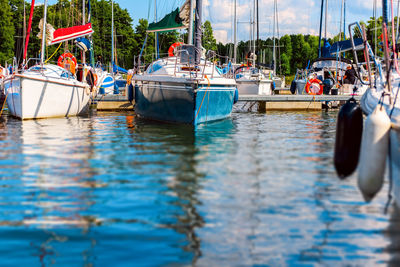 Yachts moored in a harbor. sailboats in the dock. summer vacations