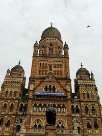 Low angle view of building against sky in mumbai, india. 