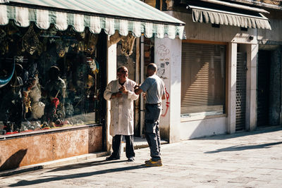 Men standing on street