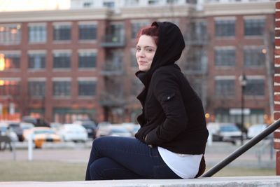 Woman standing in front of building