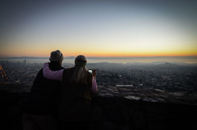 People looking at cityscape