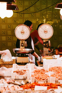 Illuminated clock at market stall