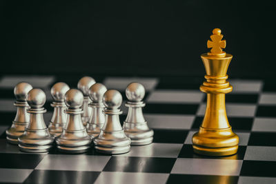 Close-up of king and pawns on chess board
