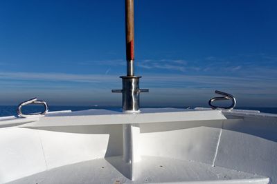 View of ship in sea against blue sky