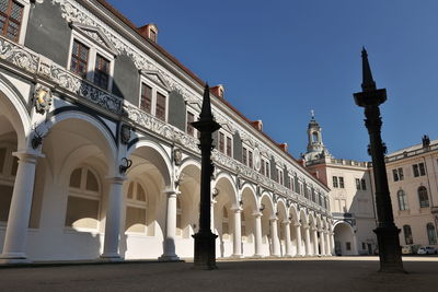 Low angle view to historical white arches of the building stallhof in dresden