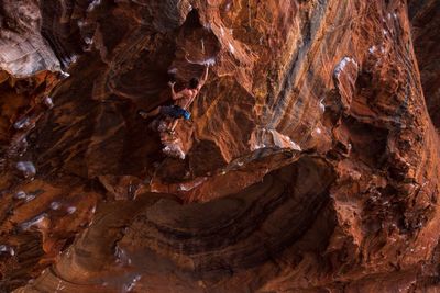 Man climbing rock face