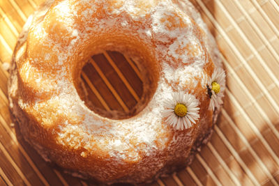 Cupcake decorated chamomile flower in the rustic style. authentic photo. easter concept greeting