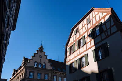 Low angle view of buildings against clear sky