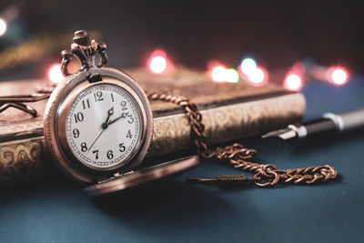 Close-up of clock on table