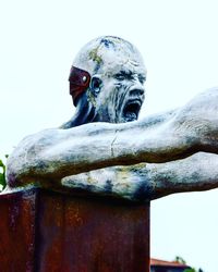 Low angle view of statue against sky