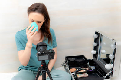 Full length of woman photographing