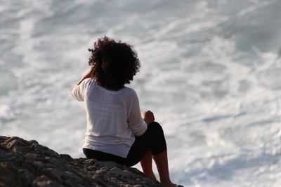 Rear view of a baby girl against the sky