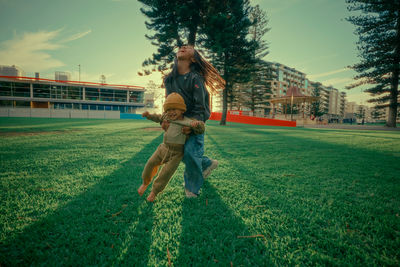 Full length of woman standing on field