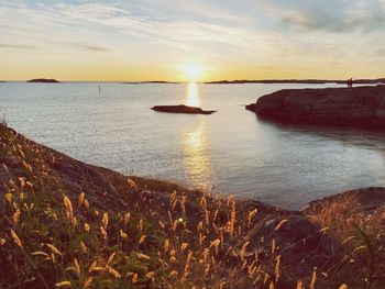 Scenic view of sea against sky during sunset