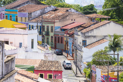 High angle view of houses and street in city