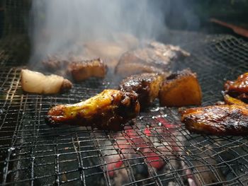 Close-up of meat on barbecue grill