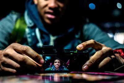 Close-up of woman holding smart phone