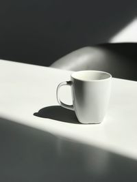 Close-up of coffee cup on table