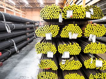 Close-up of stack of pipes in factory