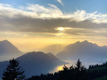 Scenic view of mountains against sky during sunset