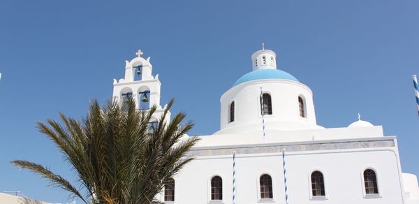 Low angle view of traditional building against clear blue sky