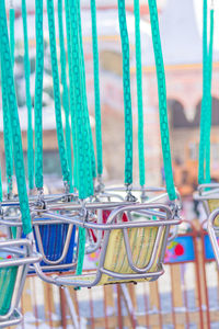 Empty seats of childrens carousel in amusement park