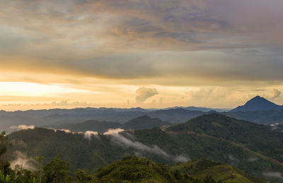 Scenic view of mountains against sky during sunset